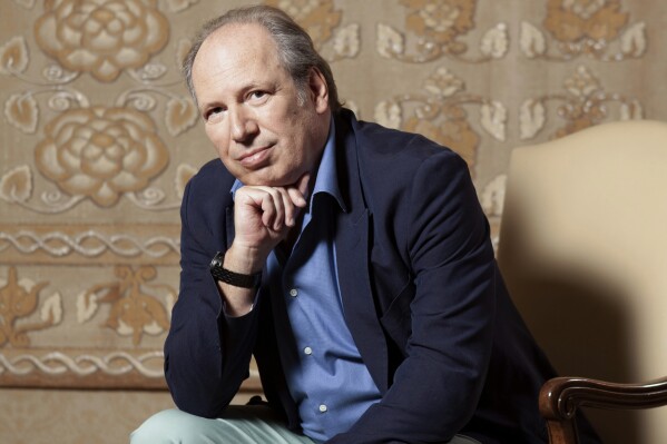 FILE - Composer Hans Zimmer poses for a portrait on July 10, 2019, at the Montage Hotel in Beverly Hills, Calif. Zimmer’s film scores have soundtracked magic movie moments in “The Lion King," "The Dark Knight” and both new “Dune” movies, to name a few. This fall, the “Hans Zimmer Live” tour will hit U.S. and Canada, marking the first time Zimmer has performed in North America in seven years. (Photo by Rebecca Cabage/Invision/AP, File)