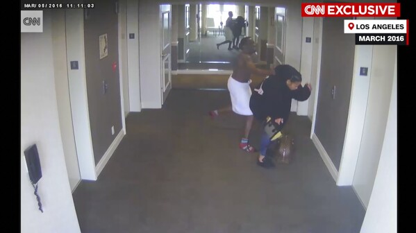 This frame grab taken from hotel security camera video and aired by CNN appears to show Sean “Diddy” Combs attacking singer Cassie in a Los Angeles hotel hallway in March 2016. (Hotel Security Camera Video/CNN via AP)