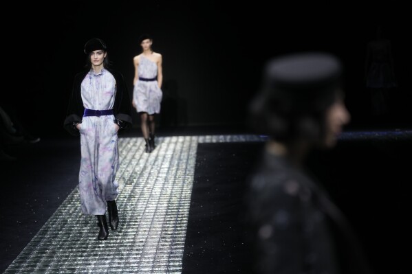 Models wear creations part of the Emporio Armani women's Fall-Winter 2024-25 collection presented in Milan, northern Italy, Thursday, Feb. 22, 2024. (APPhoto/Luca Bruno)