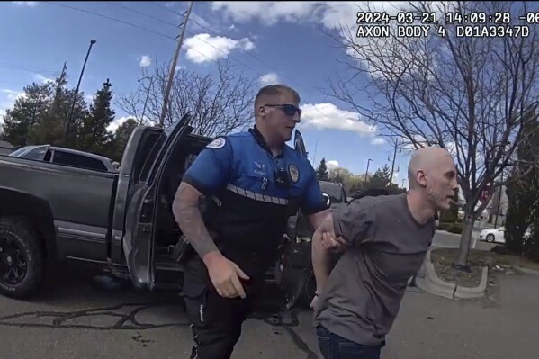 In this photo made from body camera footage and released by the Twin Falls, Idaho, Police Department, Skylar Meade, right, is arrested in Twin Falls on Thursday, March 21, 2024. Police said Meade, an Idaho prison inmate, escaped from custody when an accomplice ambushed corrections officers who were preparing to transport him back to prison from a hospital in Boise on Wednesday, March 20. Authorities say Meade and his accomplice, Nicholas Umphenour, may have been responsible for the killings of two men in northern Idaho while on the run. (Twin Falls Police Department via AP)