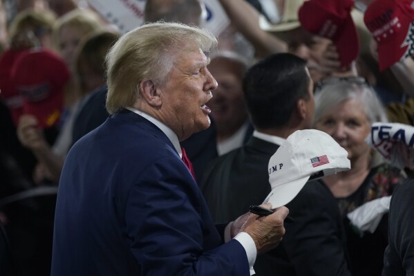 FILE = Former President Donald Trump speaks to supporters during a commit to caucus rally, Wednesday, Sept. 20, 2023, in Maquoketa, Iowa. (AP Photo/Charlie Neibergall, File)
