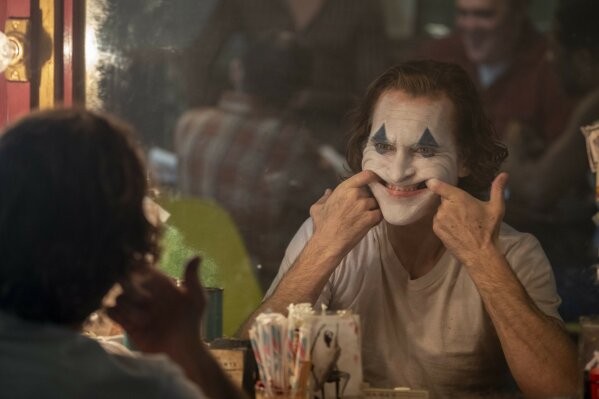 This image released by Warner Bros. Pictures shows Joaquin Phoenix in a scene from "Joker," in theaters on Oct. 4.  (Niko Tavernise/Warner Bros. Pictures via AP)