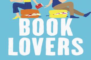 This cover image released by Berkley shows "Book Lovers" by Emily Henry. (Berkley via AP)