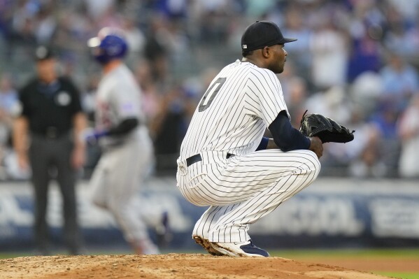 Germán scratched from scheduled start because of discomfort but pitches in  relief for Yankees