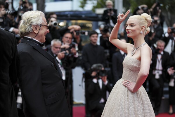 Director George Miller, left, and Anya Taylor-Joy pose for photographers upon arrival at the premiere of the film 'Furiosa: A Mad Max Saga' at the 77th international film festival, Cannes, southern France, Wednesday, May 15, 2024. (Photo by Scott A Garfitt/Invision/AP)