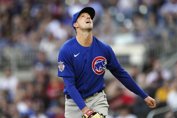 Chicago Cubs starting pitcher Drew Smyly watches the ball after surrendering a solo home run to Atlanta Braves' Austin Riley during the first inning of a baseball game Thursday, April 28, 2022, in Atlanta. (AP Photo/John Bazemore)