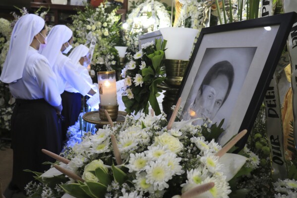 FILE - Catholic nuns visit the wake of Negros Oriental Gov. Roel Degamo at his home in Dumaguete city, Negros Oriental province, central Philippines on Monday March 6, 2023. Arnolfo Teves Jr., a former Filipino congressman accused of masterminding the brazen killings of a provincial governor and several others has been arrested in East Timor and will be deported to the Philippines, Manila officials said Friday, March 22, 2024. (AP Photo/Alan Tangcawan, File)