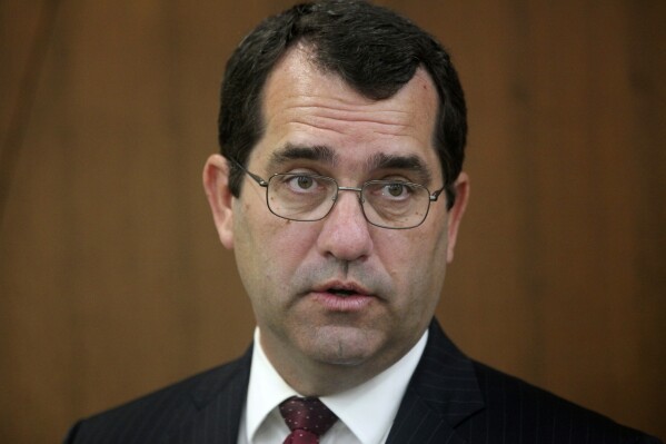 FILE - Kansas Attorney General Derek Schmidt answers questions from reporters during a news conference, Oct. 11, 2022, in Topeka, Kan. (AP Photo/John Hanna, File)