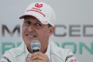 FILE - Michael Schumacher announces his retirement from Formula One during a press conference at the Suzuka Circuit venue for the Japanese Formula One Grand Prix in Suzuka, Japan, Oct. 4, 2012. The family of Formula One great Michael Schumacher plans to take legal action against a German magazine for publishing what it claimed to be an artificial intelligence-generated interview with Schumacher. Family spokesperson Sabine Kehm confirmed to The Associated Press by email on Thursday, April 20, 2023, that legal action is being planned over a “fake artificial intelligence interview by German outlet Die Aktuelle." (AP Photo/Itsuo Inouye, file)