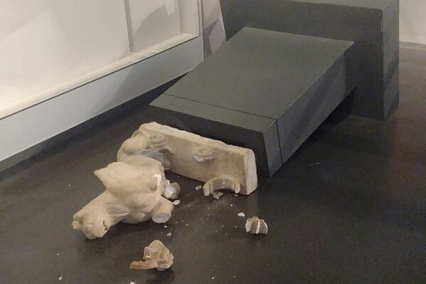 This image released by Israel Police shows an ancient Roman statue toppled at the Israel Museum in Jerusalem, Friday, Oct. 6, 2023. Israeli police have arrested an American tourist at the museum after he hurled works of art to the floor, defacing two second-century Roman statues. The vandalism late Thursday raised questions about the safety of Israel's priceless collections and stirred concern about a rise in attacks on cultural heritage in Jerusalem. (Israel Police via AP)