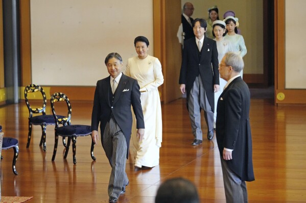 Japan's Emperor Naruhito, from left, Empress Masako, Crown Prince Akishino, Crown Princess Kiko and their daughter Princess Kako arrive at an annual celebration of poetry at the Imperial Palace in Tokyo, Friday, Jan. 19, 2024. Masako expressed her yearning for peace as a mother’s love in her poem Friday at an annual celebration of poetry at the Imperial Palace in Tokyo. (Yohei Fukai/Kyodo News via AP)