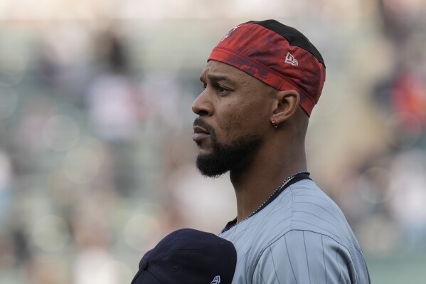 Minnesota Twins' Byron Buxton stands for The Star-Spangled Banner before a baseball game against the Chicago White Sox, Monday, April 29, 2024, in Chicago. (AP Photo/Erin Hooley)