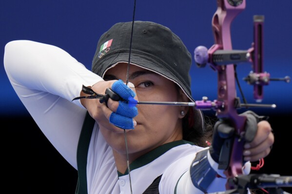 Mexico's Alejandra Valencia shoots during the archery individual quarterfinal against South Korea's Lim Si-hyeon at the 2024 Summer Olympics, Saturday, Aug. 3, 2024, in Paris, France. (AP Photo/Brynn Anderson)