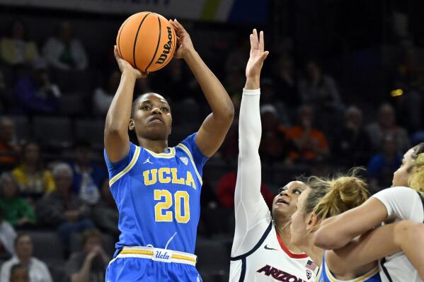 UCLA guard Charisma Osborne (20) shoots against Arizona during the first half of an NCAA college basketball game in the quarterfinal round of the Pac-12 women's tournament Thursday, March 2, 2023, in Las Vegas. (AP Photo/David Becker)
