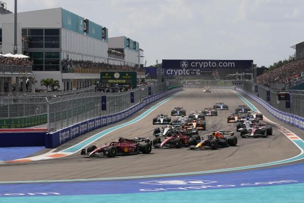 Ferrari driver Charles Leclerc of Monaco leads the field at the start of the Formula One Miami Grand Prix auto race at the Miami International Autodrome, Sunday, May 8, 2022, in Miami Gardens, Fla. (AP Photo/Darron Cummings)