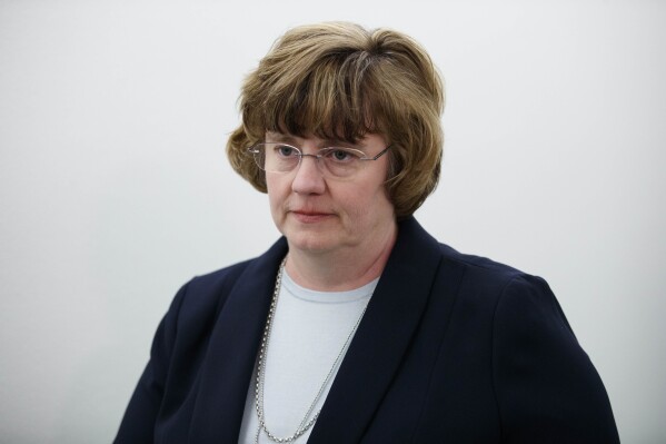 FILE - Phoenix prosecutor Rachel Mitchell returns to a Senate Judiciary Committee hearing after a break on Capitol Hill in Washington, Sept. 27, 2018. Mitchell, the Republican prosecutor of Arizona's most populous county, Maricopa County, took a thinly veiled swipe at a Democratic counterpart in the East on Wednesday, Feb. 21, 2024, saying it would be more secure to hold a man accused of stabbing two women in Arizona than to extradite him to New York City, where he is wanted in connection with the fatal bludgeoning of a woman in a hotel room. (AP Photo/Carolyn Kaster, File)