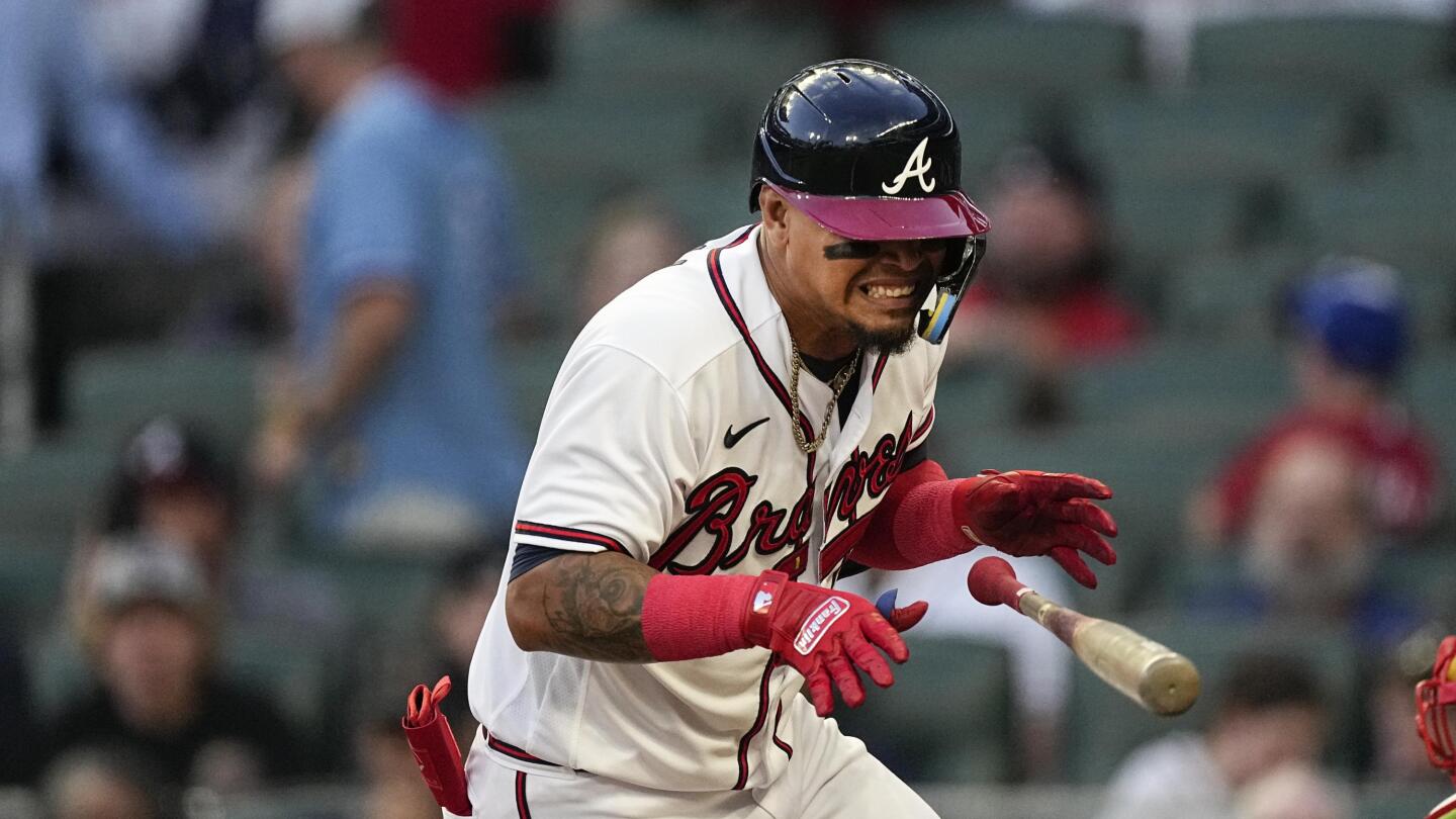 Braves' Orlando Arcia exits after being hit on the wrist with fastball