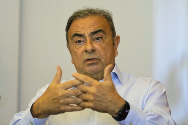 FILE - Former Nissan executive Carlos Ghosn speaks during an interview with The Associated Press in Beirut, Lebanon, on June 23, 2023. Lebanese judicial authorities have questioned two people at the request of Turkey on suspicion of being involved in the 2019 escape of auto tycoon Carlos Ghosn from Japan to Lebanon, judicial officials said Friday, Sept. 8, 2023. (AP Photo/Hassan Ammar, File)