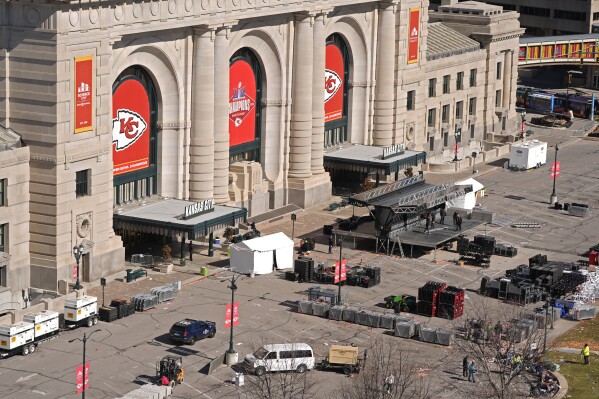 FILE - Workers dismantle the stage outside of Union Station Thursday, Feb. 15, 2024, in Kansas City, Mo. On Friday, Feb. 16, The Associated Press reported on stories circulating online incorrectly claiming a 44-year-old migrant was identified as one of the shooters at the Kansas City Chiefs’ Super Bowl parade on Wednesday. (AP Photo/Charlie Riedel, File)