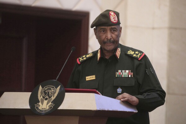 FILE - Sudan's Army chief Gen. Abdel-Fattah Burhan speaks following the signature of an initial deal aimed at ending a deep crisis caused by last year's military coup, in Khartoum, Sudan, on Dec. 5, 2022. The head of Sudan’s army warned Thursday Aug. 31, 2023 that the northeast African country will be divided if the conflict between the military and rival paramilitary force is not resolved. (AP Photo/Marwan Ali, File)