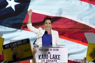 FILE - Republican Kari Lake waves to supporters as she announces her plans to run for the Arizona U.S. Senate seat during a rally, Tuesday, Oct. 10, 2023, in Scottsdale, Ariz. On Monday, Oct. 16, a federal appeals court tossed out a lawsuit brought by former Arizona gubernatorial candidate Lake that was previously dismissed, challenging use of electronic voting machines and sought to ban them in last year’s midterm elections. (AP Photo/Ross D. Franklin, File)