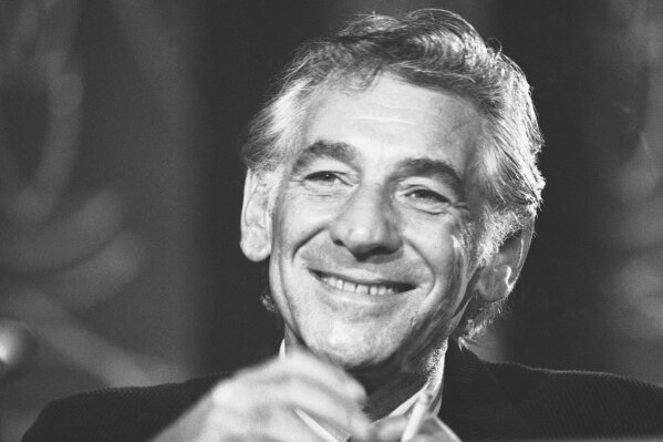 
              FILE - In this July 26, 1971 file photo conductor Leonard Bernstein tells reporters in Washington that the work he is preparing for the 1971 opening of the John F. Kennedy Center for the Performing Arts is a "labor of love." Leonard Bernstein is getting a musical tribute that’s off the charts on the 100th anniversary of the maestro’s birth. The Boston Symphony Orchestra will be joined by musicians from the New York Philharmonic, Vienna Philharmonic Orchestra, Israel Philharmonic Orchestra and other groups when it takes the stage Saturday, Aug. 25, 2018 at its summer home at Tanglewood in Massachusetts. Performers include Yo-Yo Ma. Bernstein wrote the score to “West Side Story” and won a slew of Grammys. (AP Photo/Charles Harrity, File)
            