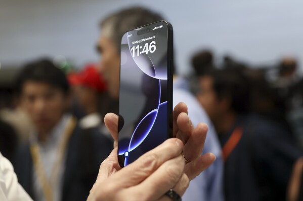 The new iPhone 16 is displayed during an announcement of new products at Apple headquarters Monday, Sept. 9, 2024, in Cupertino, Calif. (AP Photo/Juliana Yamada, File)