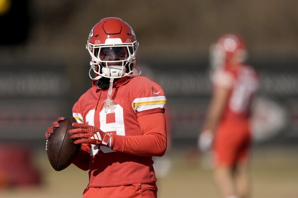 Kansas City Chiefs wide receiver Kadarius Toney passes the ball during the team's NFL football practice Friday, Feb. 2, 2024 in Kansas City, Mo. The Chiefs will play the San Francisco 49ers in Super Bowl 58. (AP Photo/Charlie Riedel)