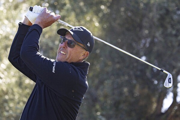 Captain Phil Mickelson, of HyFlyers GC, hits from the 12th tee during the final round of LIV Golf Las Vegas at Las Vegas Country Club, Saturday, Feb. 10, 2024, in Las Vegas. (Doug DeFelice/LIV Golf via AP)