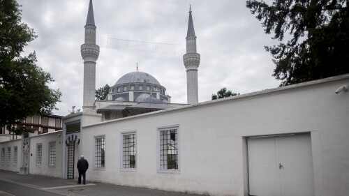 A man walks towards the Sehitlik Mosque in Berlin, Germany, Thursday, June 29, 2023.  Racism, hatred and sometimes violence against Muslims in Germany is widespread and often part of their everyday experience, said a new report that was presented to the Interior Ministry in Berlin on Thursday.  Its conclusion is that at least a third of Muslims in Germany have experienced hostility because of their religion.  (AP Photo/Markus Schreiber)