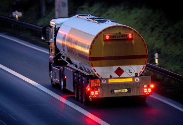 FILE - A fuel trucks drives along a highway in Frankfurt, Germany, Jan. 27, 2023. European Union governments tentatively agreed Friday Feb. 3, 2023, to set a $100-per-barrel price cap on sales of Russian diesel to coincide with an EU embargo on the fuel — steps aimed at ending the bloc's energy dependence on Russia and limiting the money Moscow makes to fund its war in Ukraine. (AP Photo/Michael Probst, File)