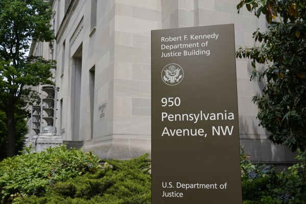 FILE - The exterior of the Robert F. Kennedy Department of Justice building is pictured on May 4, 2021, in Washington. U.S. regulators on Monday, Oct. 30, 2023, sued SolarWinds, a Texas-based technology company whose software was breached in a massive 2020 Russian cyberespionage campaign, for fraud for failing to disclose security deficiencies ahead of the stunning hack. Detected in December 2020, the SolarWinds hack penetrated U.S. government agencies, including the Justice and Homeland Security departments, and more than 100 private companies and think tanks. It was a rude wake-up call on the perils of neglecting cybersecurity. (AP Photo/Patrick Semansky, File)