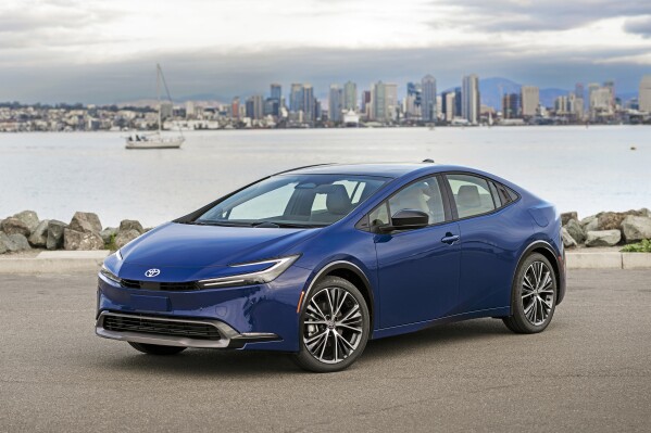 This photo provided by Toyota shows the 2023 Toyota Prius. The latest generation has sleek styling and much-improved acceleration to go along with its stellar fuel economy of up to an EPA-estimated 57 mpg. (Nathan Leach-Proffer/Courtesy of Toyota Motor Sales U.S.A. via AP)