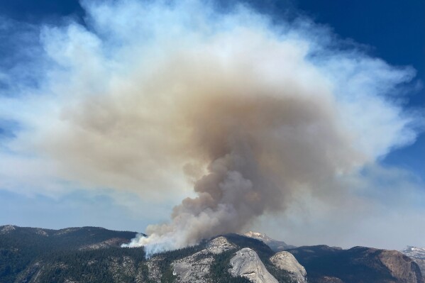In this photo provided by the National Park Service smoke rises from the Pika Fire in Yosemite National Park, Calif., Saturday, July 15, 2023. The fire was started by lightning on June 29, 2023. (Mark Ruggiero/National Park Service via AP)