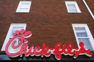 FILE - In this Oct. 30, 2018 file photo, Chick-fil-A signage is displayed in downtown, Athens, Ga. Chick-fil-A said Monday, Sept. 14, 2020, that it no longer plans to open a restaurant in the San Antonio airport, even though the Texas city relented and agreed to let it do so after more than a year of legal wrangling. (Joshua L. Jones/Athens Banner-Herald via AP, File)