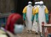 FILE鈥� In this July 16, 2019 photo, health workers dressed in protective gear begin their shift at an Ebola treatment center in Beni, Congo DRC. Internal documents obtained by 花椒直播 show that the World Health Organization has paid $250 each to at least 104 women in Congo who say they were sexually abused or exploited by Ebola outbreak responders. That amount is less than what some U.N. officials are given for a single day's expenses when working in Congo. (AP Photo/Jerome Delay, File)