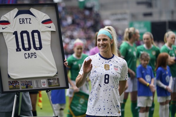 FILE - United States midfielder Julie Ertz (8) waves after she was presented a jersey marking her 100th match before an international friendly soccer match against Ireland in Austin, Texas, Saturday, April 8, 2023. Two-time U.S. Soccer Player of the Year Julie Ertz has retired from soccer after a 10-year career that included back-to-back Women's World Cup titles. I gave everything I had to the sport that I love,” she said in a statement announcing her retirement, Thursday, Aug. 31, 2023. (AP Photo/Eric Gay)