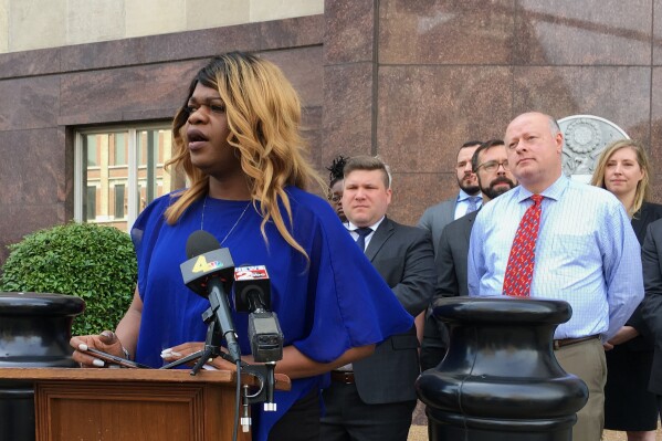 FILE - Lead plaintiff Kayla Gore speaks at a news conference outside the federal courthouse in Nashville, Tenn., Tuesday, April 23, 2019. The fate of a decades-old Tennessee law that does not allow transgender people to change the sex designation on their birth certificates is in the hands of a federal appeals court. (AP Photo/Travis Loller, File)