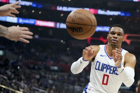 Los Angeles Clippers guard Russell Westbrook catches an inbound pass during the first half of an NBA basketball game against the Sacramento Kings, Sunday, Feb. 25, 2024, in Los Angeles. (AP Photo/Ryan Sun)