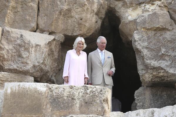 Britain's Prince Charles and his wife, Camilla visit the pyramids of Giza, on the edge of Cairo, Egypt, Thursday, Nov. 18, 2021. The visit is part of the royal couple's first tour since the start of the coronavirus pandemic. (AP Photo/Mohamed El-Shahed)