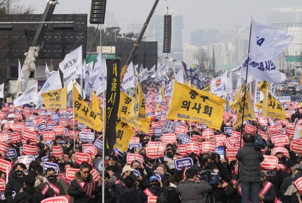 Doctors stage a rally against the government's medical policy in Seoul, South Korea, Sunday, March 3, 2024. Thousands of senior doctors rallied in Seoul on Sunday to express their support for junior doctors who have been on strike for nearly two weeks over a government plan to sharply increase the number of medical school admissions.(AP Photo/Ahn Young-joon)