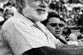 
              FILE - In this Nov. 1960 file photo, U.S. novelist Ernest Hemingway attends a bullfight in Madrid, Spain. Two Ernest Hemingway stories written in the mid-1950s and rarely seen since ...