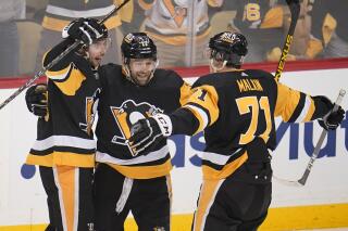 Pittsburgh Penguins' Bryan Rust (17) celebrates his goal during the first period in Game 6 of the team's NHL hockey Stanley Cup first-round playoff series against the New York Rangers in Pittsburgh, Friday, May 13, 2022. (AP Photo/Gene J. Puskar)