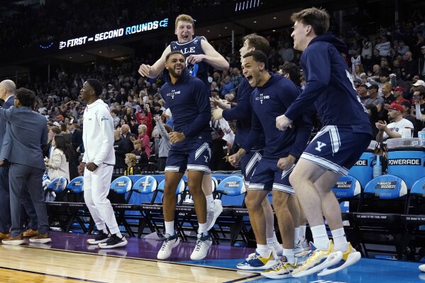 Yale players react on the bench during the second half of Yale's upset of Auburn in a first-round college basketball game in the men's NCAA Tournament in Spokane, Wash., Friday, March 22, 2024. (AP Photo/Ted S. Warren)