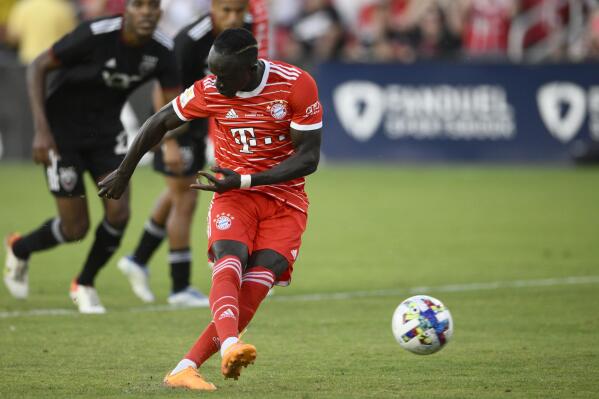 Bayern Munich forward Sadio Mane scores on a penalty kick during the first half of the team's friendly soccer match against D.C. United, Wednesday, July 20, 2022, in Washington. (AP Photo/Nick Wass)