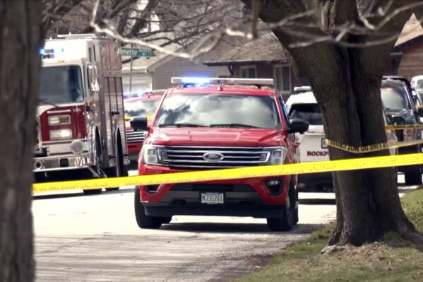 In this image taken from video provided by WTVO-TV/WQRF-TV/NewsNation. emergency personnel work at the scene, Wednesday, March 27, 2024, in Rockford, Ill., where four people were killed and five were wounded in stabbings in northern Illinois. Redd said that a suspect is in police custody and was being questioned. She said police did not know the motive. (WTVO-TV/WQRF-TV/NewsNation via AP)