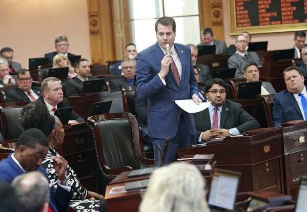 FILE - Ohio Rep. Derek Merrin stands while he advocates a yes vote on the Heartbeat Bill at the Ohio Statehouse in Columbus, Ohio on Wednesday, April 10, 2019. Since last year, GOP candidates for Ohio’s 9th Congressional District have left and entered the field on a dime, endorsements have hopped from campaign to campaign, and several big-name Republicans have split their loyalties three ways. (Brooke LaValley/The Columbus Dispatch via AP)