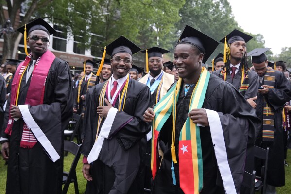 Graduating students arrive at the Morehouse College commencement before President Joe Biden speaks, Sunday, May 19, 2024, in Atlanta. (AP Photo/Alex Brandon)