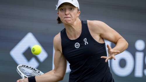 Poland's Iga Swiatek hits a forehand to Switzerland's Jil Teichmann during their match at the WTA tennis tournament in Bad Homburg, Germany, Wednesday, June 28, 2023. (AP Photo/Michael Probst)