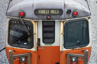 An older subway car, with spots of rust on the exterior shell, is a parked with lights on at the Orange Line's Wellington Station train yard, Wednesday, July 13, 2022, in Medford, Mass. Transit officials are taking what they are describing as the “unprecedented” step of shuttering one of Boston’s four major subway lines for 30 days to allow for track and signal work. The month-long shutdown starting Aug. 19, is the latest in a string of frustrating developments for Boston-area commuters who have suffered through fires, stalled trains and subway slowdowns. (AP Photo/Charles Krupa)